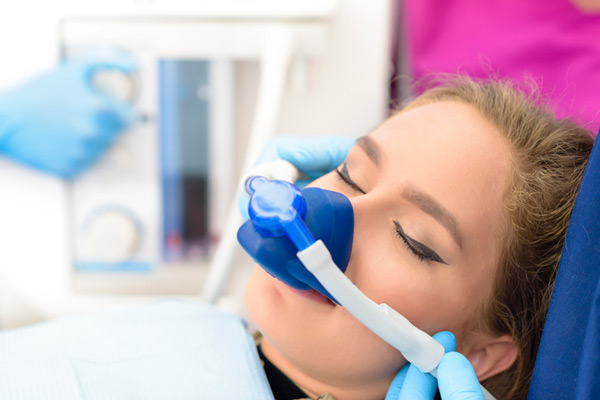 Sedated girl in dental chair at Grins & Giggles Family Dentistry in Spokane Valley, WA