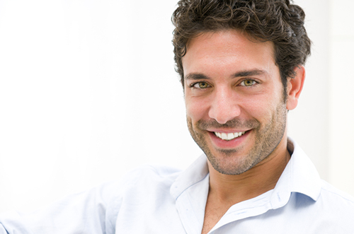 Man smiling about his cosmetic dental bonding by Grins & Giggles Family Dentistry in Spokane Valley, WA